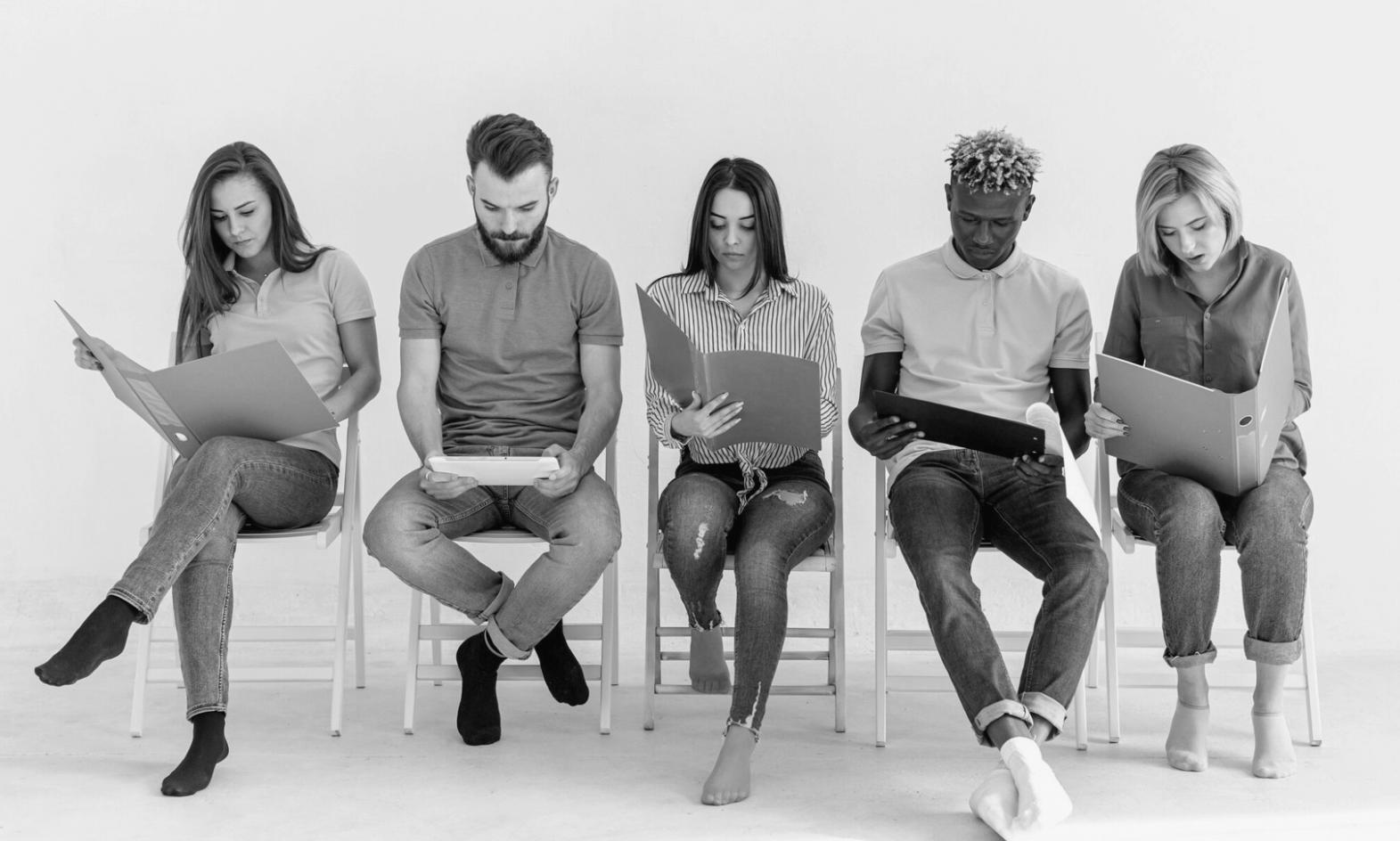 Professional financial consultation meeting with business team reviewing documents and strategic planning materials